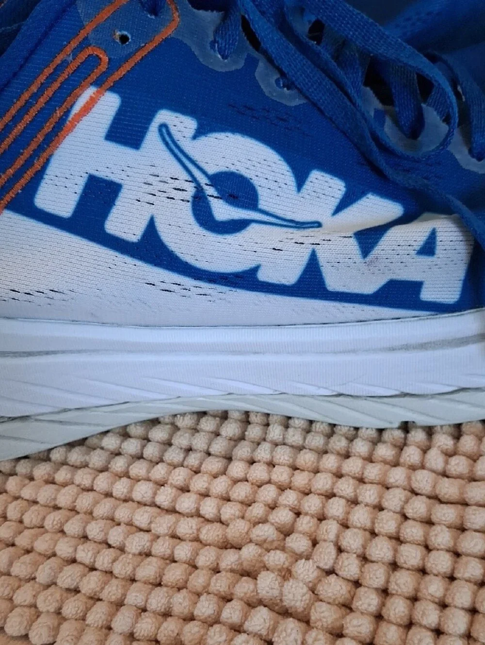 Hoka Blue and White Men's Running Shoes with Orange Accents